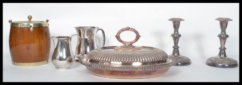 A collection of silver plated items to include a pair of Victorian silver plated copper candlesticks