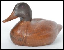 A vintage 20th century finely carved decoy Mallard Hen duck with inset glass eyes. Measures 27 cm