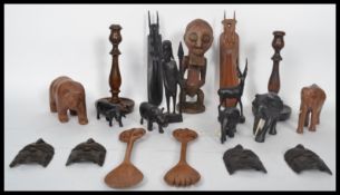 A large collection of African hardwood carved animals made of ebony and hardwoods comprising of