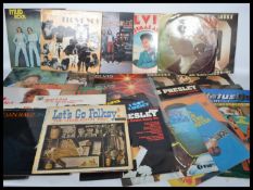 A collection of vinyl long play records dating from the 1960s featuring various artists to include