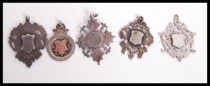 A collection of silver hallmarked medals, all with plain cartouche panels. To include one with