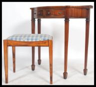 A 1920's oak dressing stool in the Arts & Crafts manner together with a Georgian revival mahogany