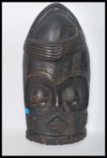 A late 19th century early 20th century large hand carved wooden tribal ceremonial  Mask