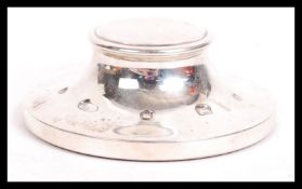 A contemporary silver hallmarked paperweight of circular form being hallmarked for Birmingham