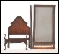 A 1930's Queen Anne Walnut Heals & Co single bed having tall shaped headboard with double pair