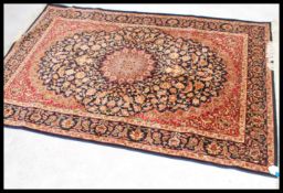 A large Iranian / Persian Keshan carpet - rug having blue ground with geometric decoration and