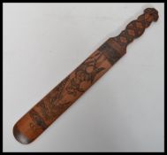 A 19th century Chinese page turner of bamboo construction depicting a man falling off a donkey.