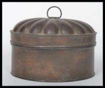 A 19th century Victorian tin spice box complete with grater. The box having a fluted lid opening