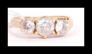 A hallmarked 22ct gold three stone ring.  Set with three white stones. Hallmarked Birmingham. Weight