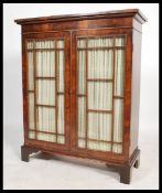 A 19th century Victorian mahogany astral glazed linen backed two door library  bookcase. The