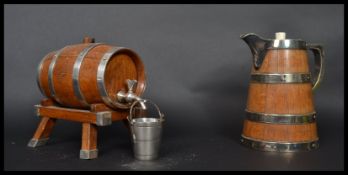A 19th century water jug and brandy barrel in the form of coopered barrels having silver plated
