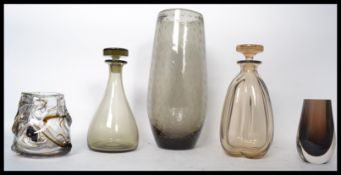 A collection of Whitefriars studio glass to include a tall bubble control vase, two decanters with