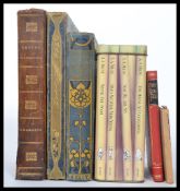 A collection of vintage and antique books dating from the early 129th century to include three books