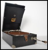 An early 20th century 1930's HMV His Masters Voice table top picnic gramophone having a brown