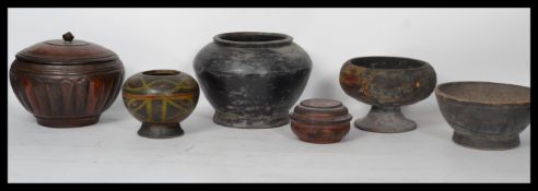 A collection of six vintage early 20th Century and older Chinese wooden turned lacquered pots,
