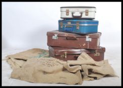 A stack of vintage / retro suitcases to include flight cases for British Airways and BEA