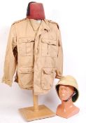 20TH CENTURY MILITARY STYLE PITH HELMET, TUNIC AND FEZ