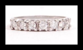 A hallmarked 9ct white gold and CZ seven stone rin