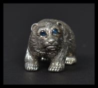 A sterling silver figure in the form of a grizzly