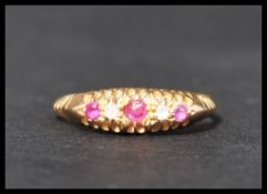 A hallmarked antique 18ct gold 5 stone ring set wi