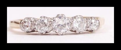 An 18ct gold and platinum and diamond 5 stone ring