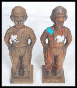A pair of large cast metal fireside companions / d
