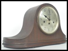 An early 20th century oak cased mantle clock of ge