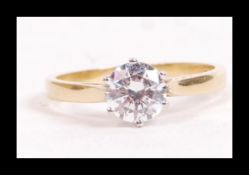 An 18ct gold and CZ solitaire ring set with a roun