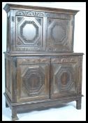A 19th century Jacobean revival oak carved oak dre