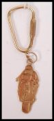 A hallmarked 9ct gold key chain in the form of a m