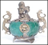 An early 20th century silver plated  incense pot of bulbous form having a green jade type stone body