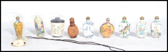 A group of ten Oriental Chinese perfume scent bottles of varying form and patterns. To include