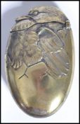 A vintage early 20th century silver plated match vesta in the form of a hatching bird, hinged