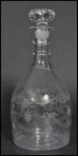 A 19th century Georgian hand blown cut glass decanter having an engraved body. The decanter of