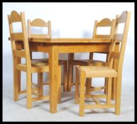 A good quality solid oak draw leaf extending dining table raised on squared legs with solid oak