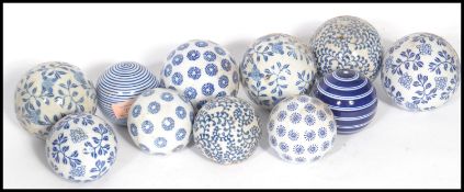 A group of twelve mid century blue and white ceramic carpet bowls of varying designs and patterns.