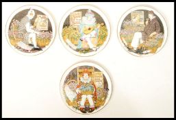 A set of four Royal Doulton Behind The Painted Masque Convex wall plaque plates to include Make Me