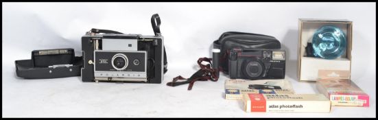 A vintage / retro 20th century cased folding Polaroid 250 automatic land camera together with a