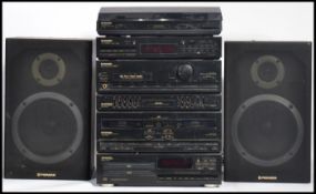 A vintage retro Pioneer music stacking system to include speakers , records player , radio ,