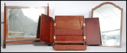 A good 19th century mahogany bathroom / toilet swing mirror raised on shaped leg supports with brass