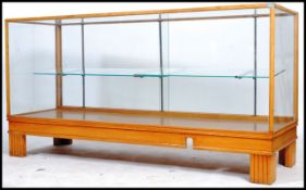 An early 20th century  Industrial Haberdashery shop display cabinet being raised on a plinth base