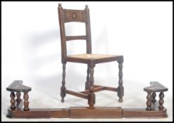 A 19th century carved oak club fire fender kerb. The fender with spindle gallery above the base kerb