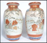 A pair of 19th century Japanese Kutani vases having hand painted decoration depicting elders with