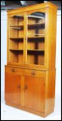 A mid 20th century Air Ministry style oak library bookcase cupboard. The base with drawers and