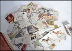 A shoe box of vintage cigarette cards , many hundreds of odds and part sets , 3 sets , Wills ,