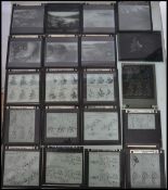 A collection of vintage 20th century glass plate slides held within vintage Kodak boxes. Mostly