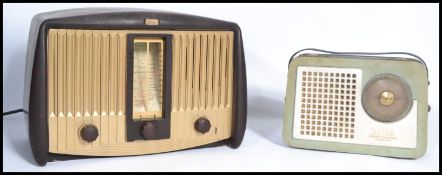 A vintage mid 20th century transistor radio by Decca together with another vintage bakelite radio by