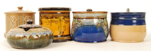 A group of Doulton tobacco jars to include Dickensian ice skating and snowball example , Silicon