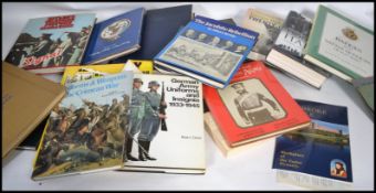 A large collection of assorted WWII German related books and publications - various subjects and