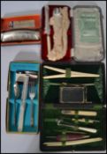 A 19th century cased vanity necessaire set having various needles picks glove stretcher etc along